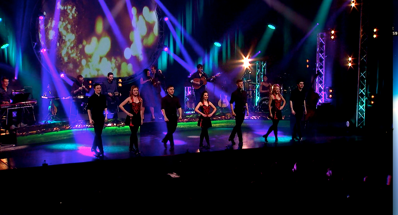 Full Production line of dancers on stage showing lighting