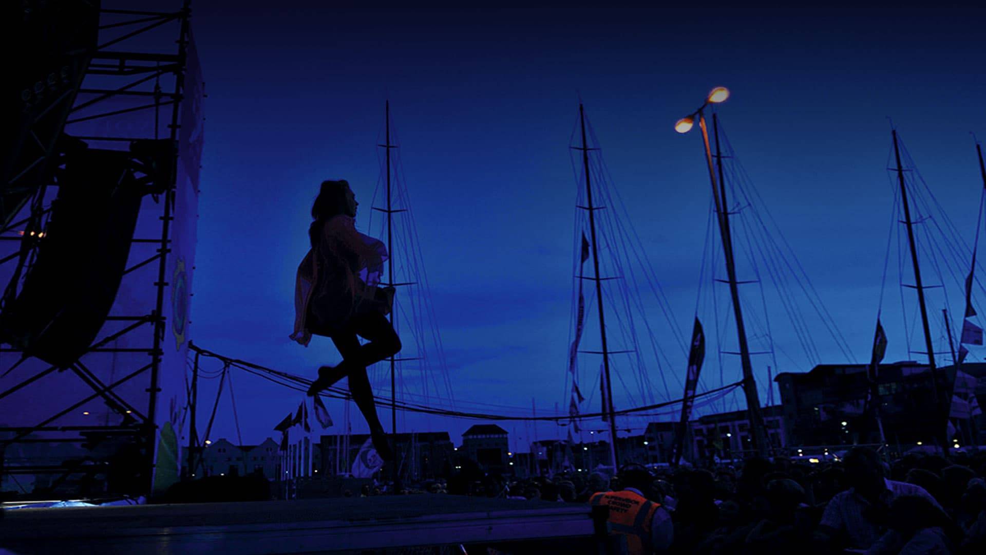 Dancer silhouette at dusk on quay 